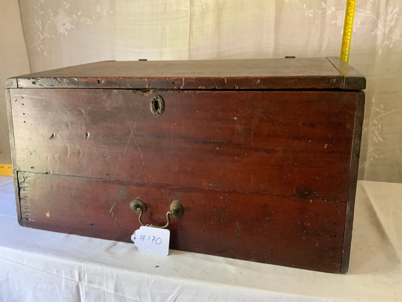 Lift Top Cherry Desk: Lift top cherry table top desk w/ 1 long drawer, 14" tall, 25" wide, 22" deep, old red wash, divided interior, hole in the back board. Overall good condition.