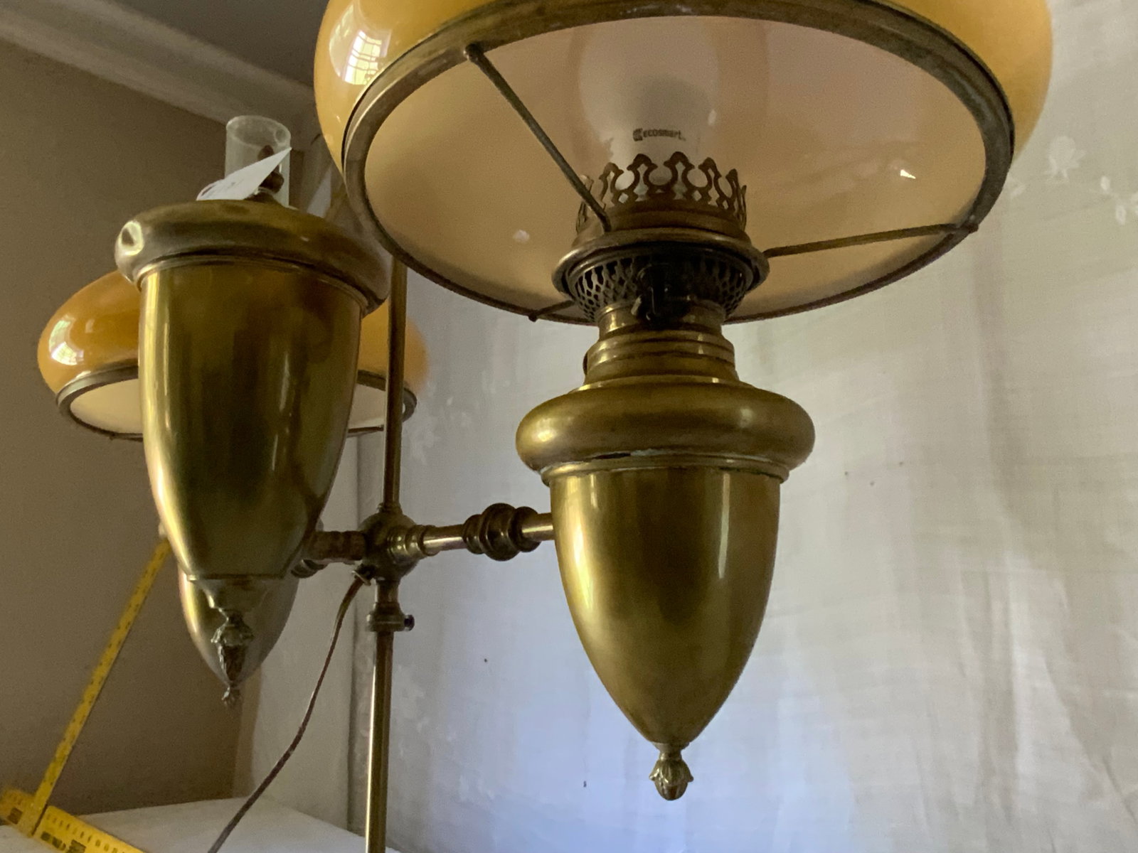 Brass Double Student Lamp: Brass double student lamp w/ apricot-colored shades, electrified. Good condition.