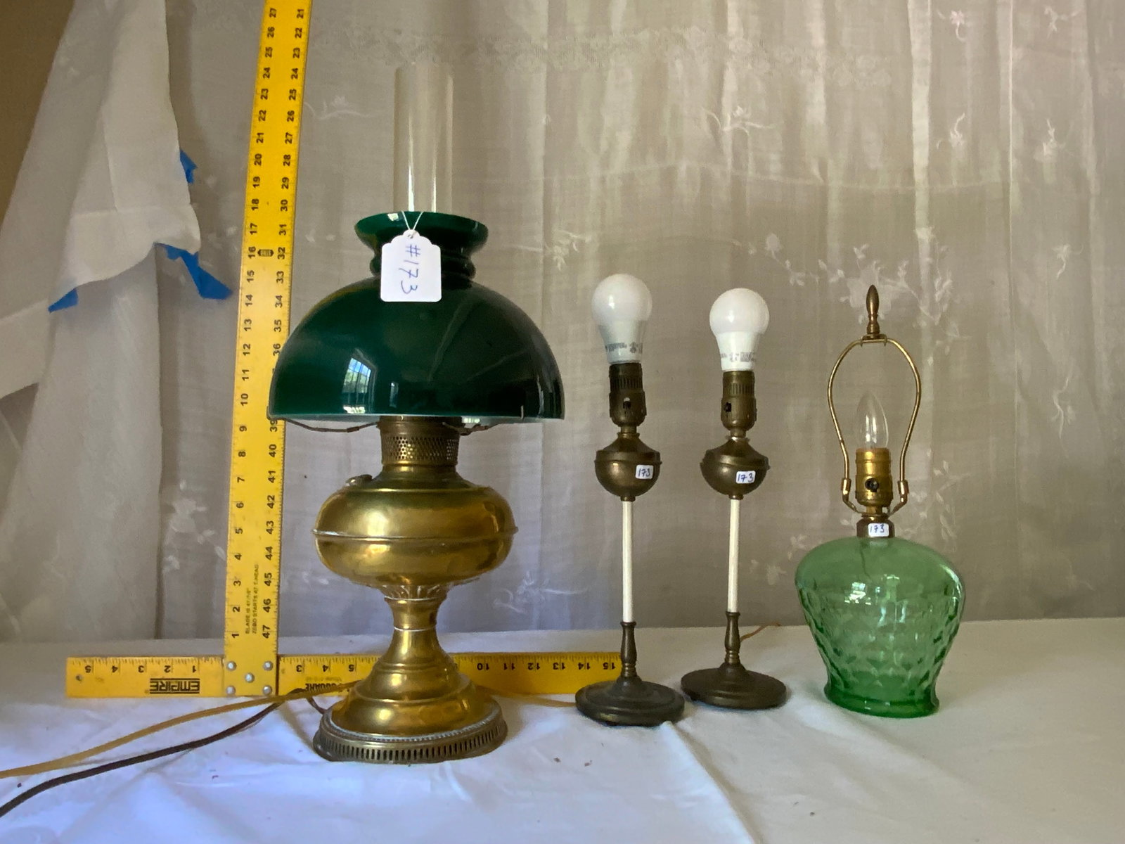 Electric Lamps: 3 electric lamps: 1 green glass, 1 brass Rayo style w/ green shade, 2 stick lamps (1 as-is). Overall good condition.