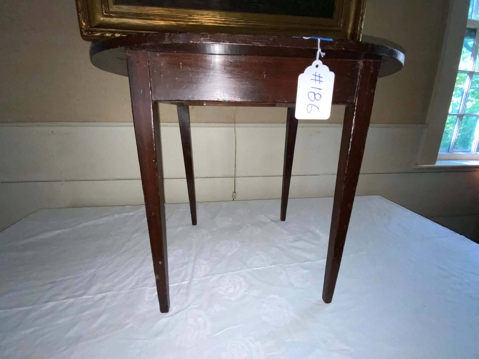 Child's Table: Child's table, 19th century, pegged tapering legs, top has been trimmed, likely started as a square top table, 24 inch oval by 19 inches tall.
