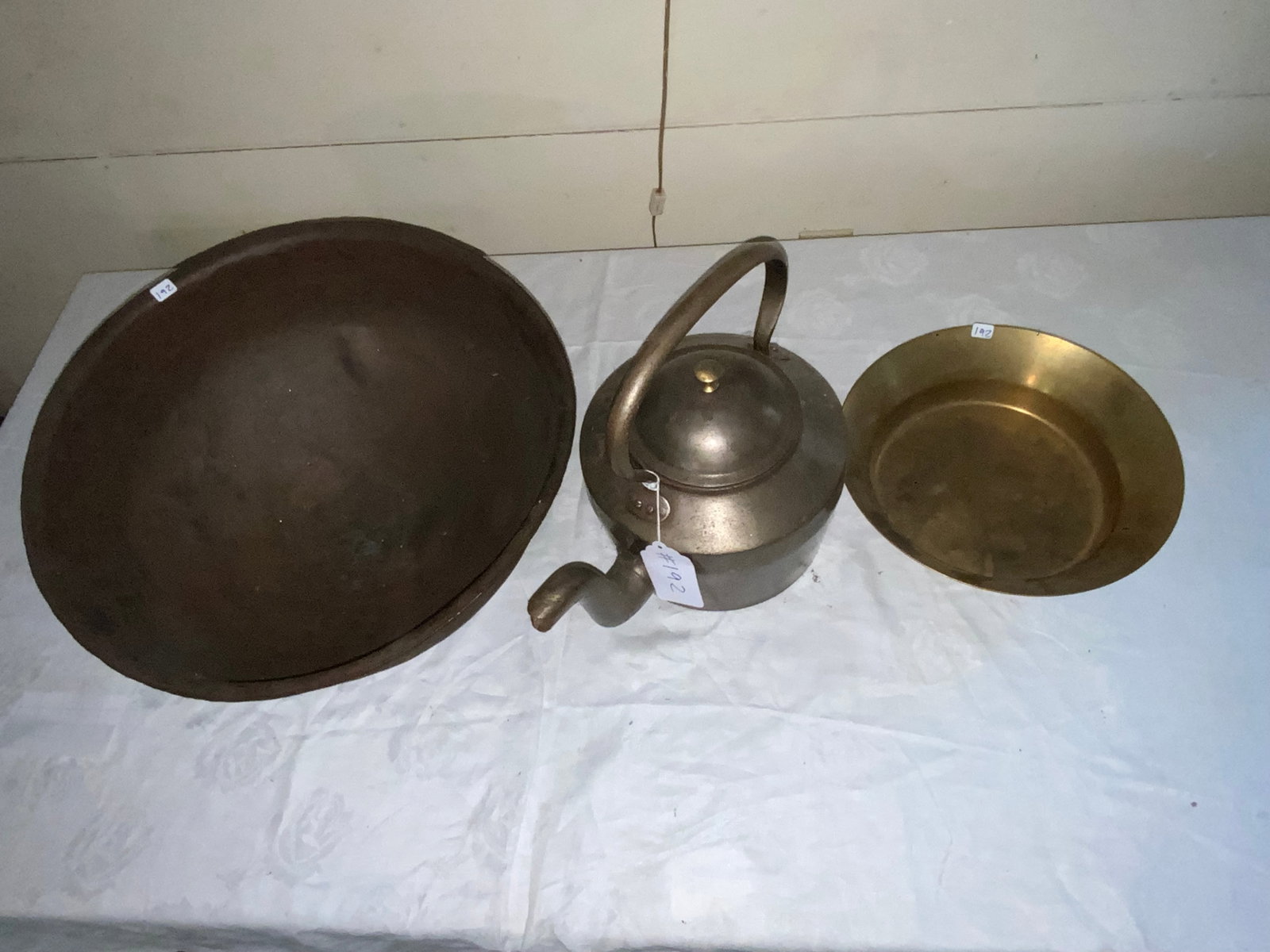 Copper Lot: 3 pc lot of copper: 1 large brown finish bowl, 17" round, 8" tall; 14" across x 12" tall tea pot w/ fixed handle; brass bowl 11" x 3" tall. Good condition.