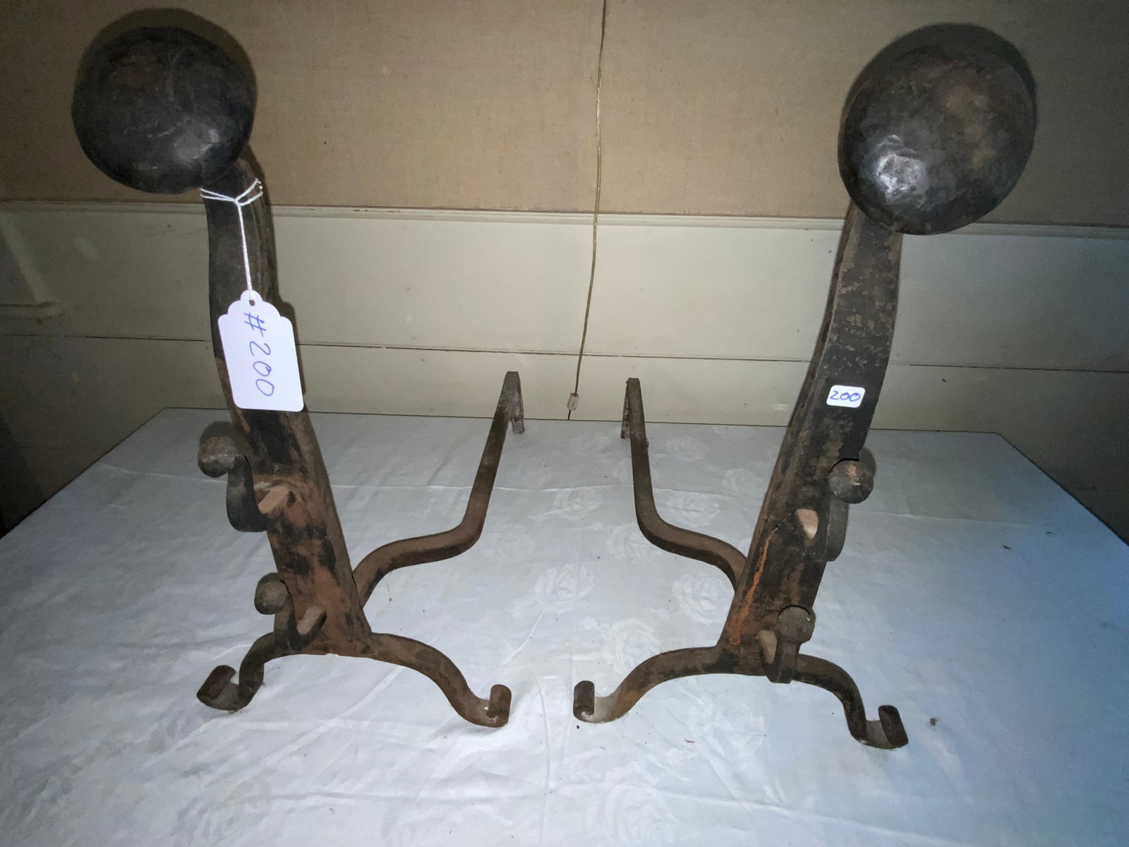 Wrought Andirons: Hand wrought andirons, 21 1/4" tall, scrolled feet, knob top. Good condition.