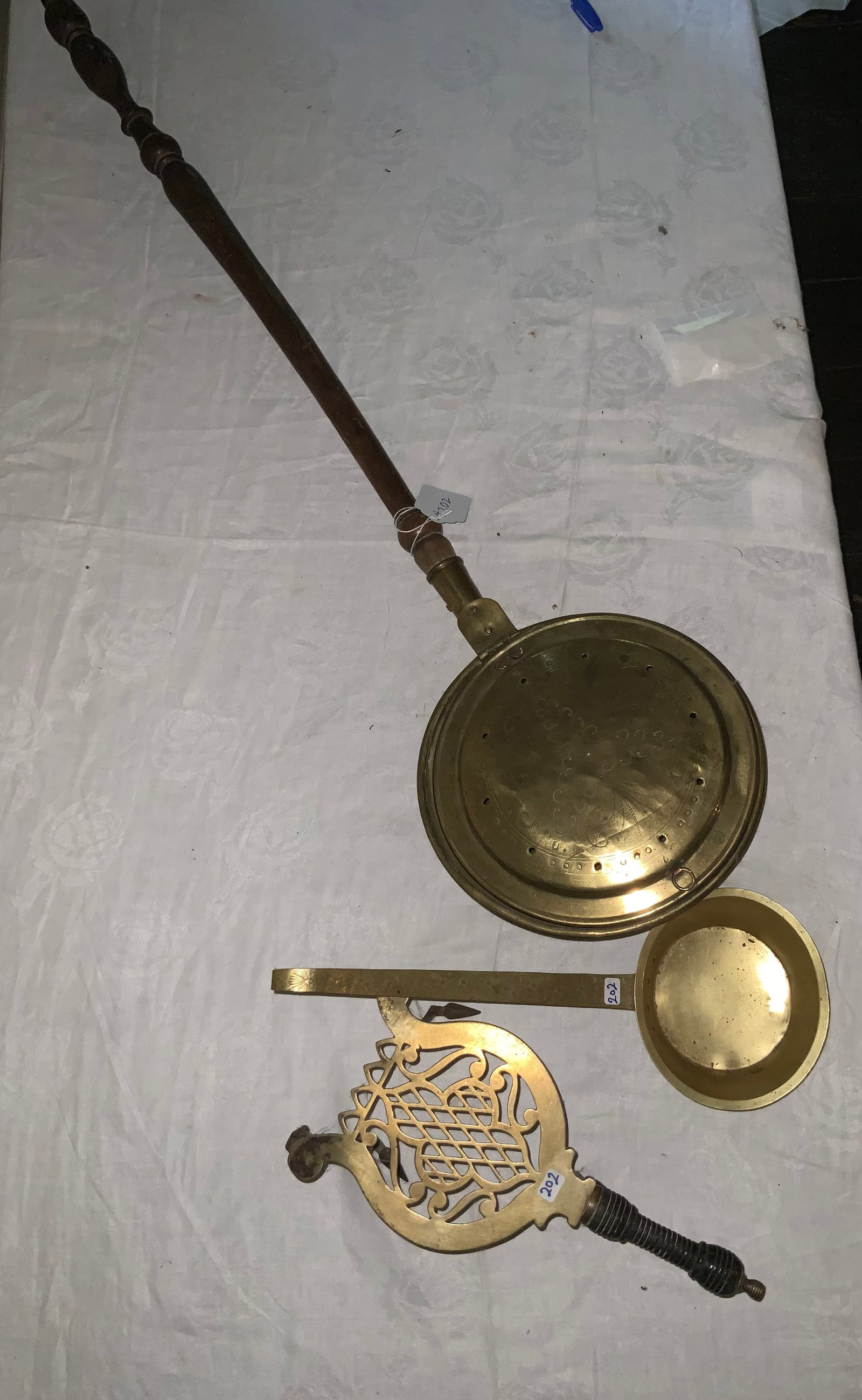 Brass Hearth Set: Brass hearth trivet, brass scoop, chestnut roasters. All good condition.