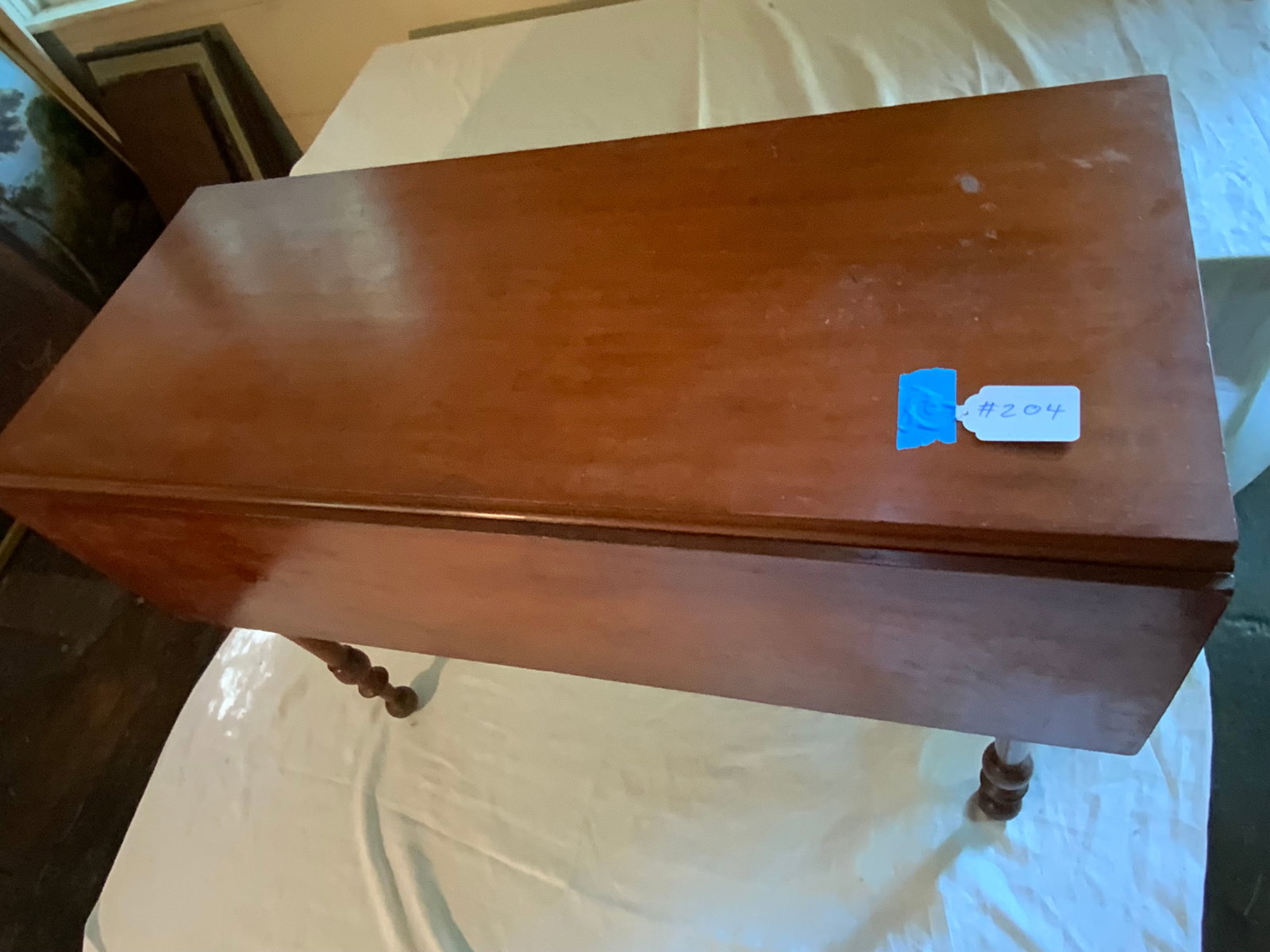 Cherry Drop Leaf Table: Cherry drop leaf table, 1820-1840, New England, turned legs continuing to ball feet, 41" x 42" open, 29" tall, 17" x 44" closed. Good condition.