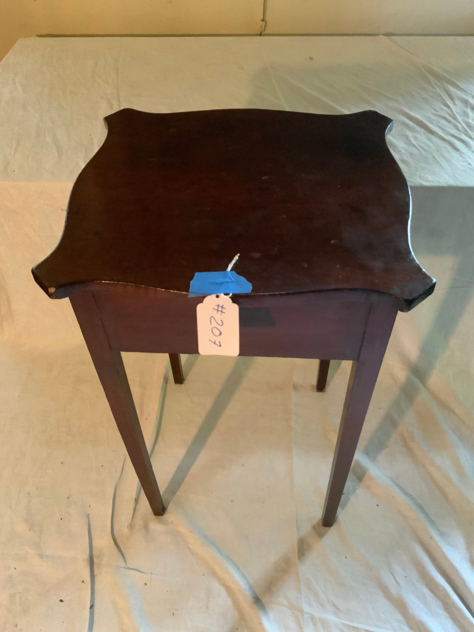 Federal Cherry Table: Federal cherry, 18th century, serpentine top, canted corners, tapering legs. Good condition.