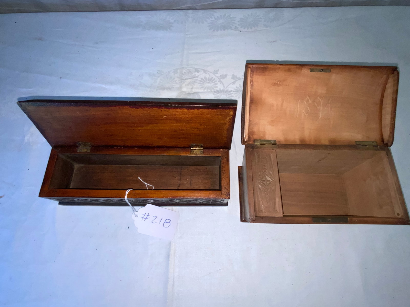 Carved Boxes: 2 boxes: 1st flat top carved box on top and all sides, 11" wide, 3 1/2" deep, 3" tall; 2nd carved dome box with nice heavy carving, 8 1/2" long, 4 1/2" wide, 4 1/2" tall, dated 1894.