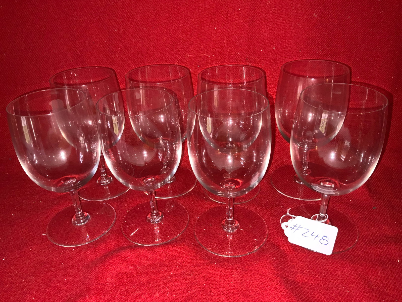 Baccarat Wine Glasses: Baccarat wine glasses, 7 total, good condition, 1 has a chip in the bottom.