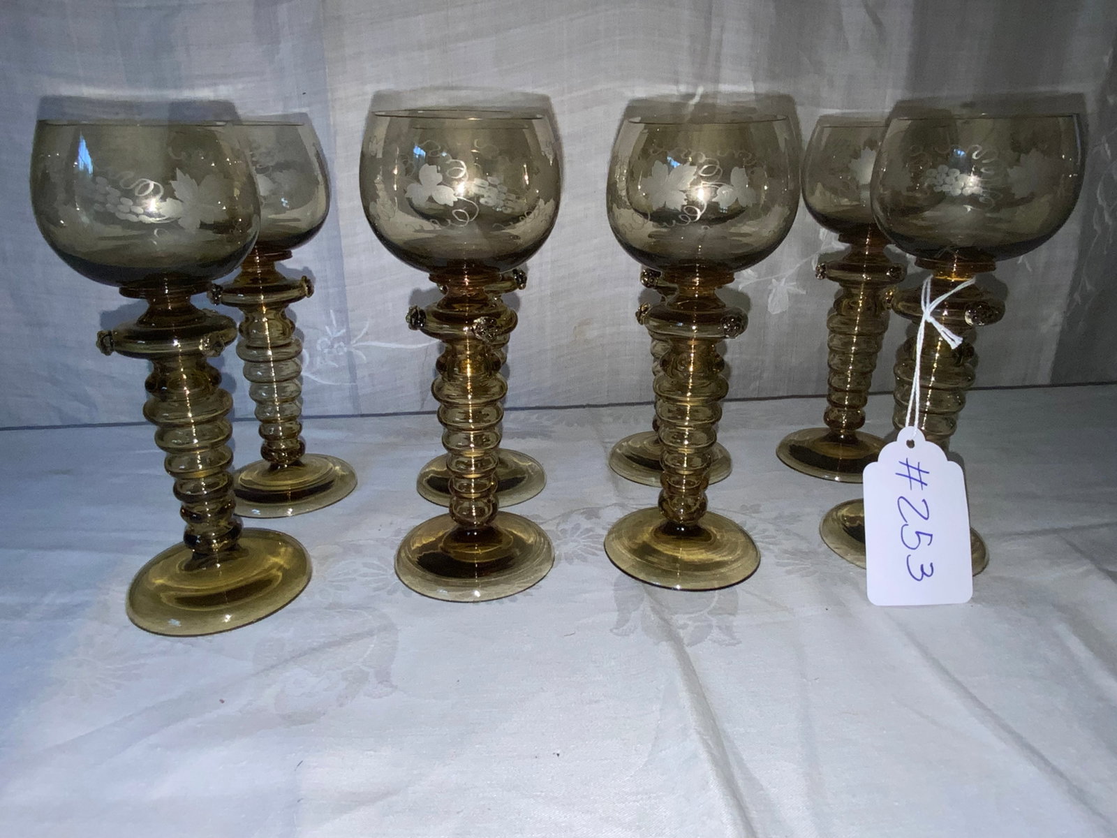 German Rhine Wine Goblets: German Rhine set of 8 wine goblets, pale olive green, 2 1/2" wide, etched grape design, applied rosettes. Good condition.