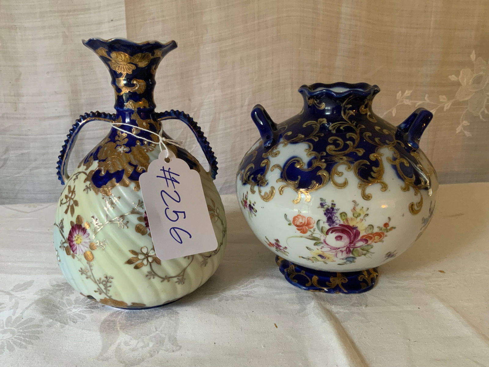Blue & White Porcelain Vases: 2 vases, blue & white decorated porcelain, 16" tall, 17 1/2" tall.