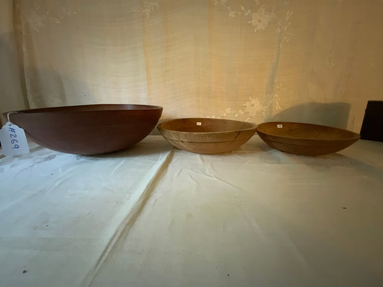 Wooden Bowls: 3 wooden bowls: 1st 16 1/2", 2nd 13 1/4" (has a crack), 3rd 11" round. Good condition.