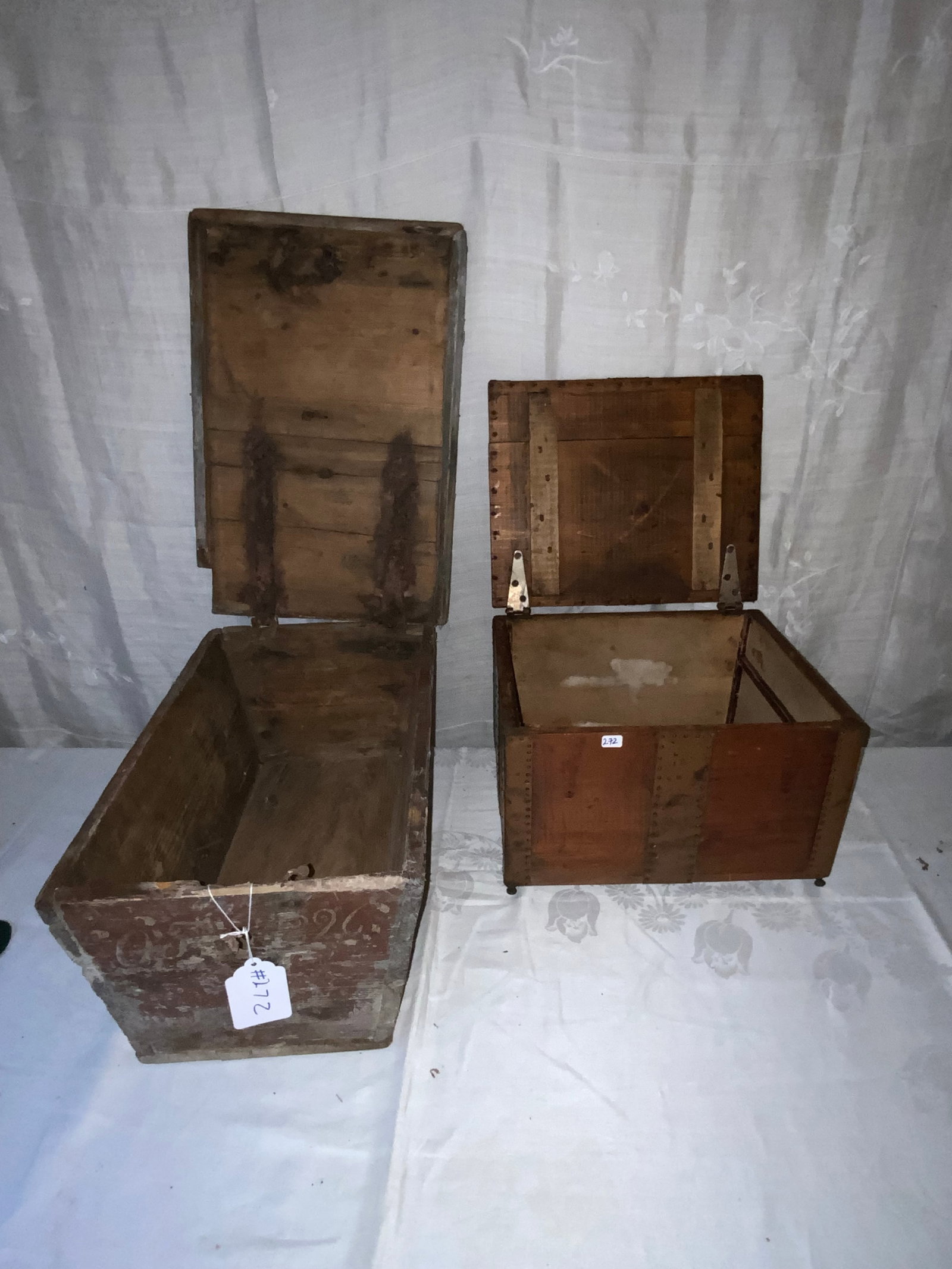 Strap-Hinged Boxes: 2 boxes: 1st strap hinged, dovetailed, 12 1/2" x 18 1/2", 8" tall, early box, old red finish; 2nd strap nailed, small peg feet, 13" x 11", 8 1/2" tall, copper strapping. Fair condition.