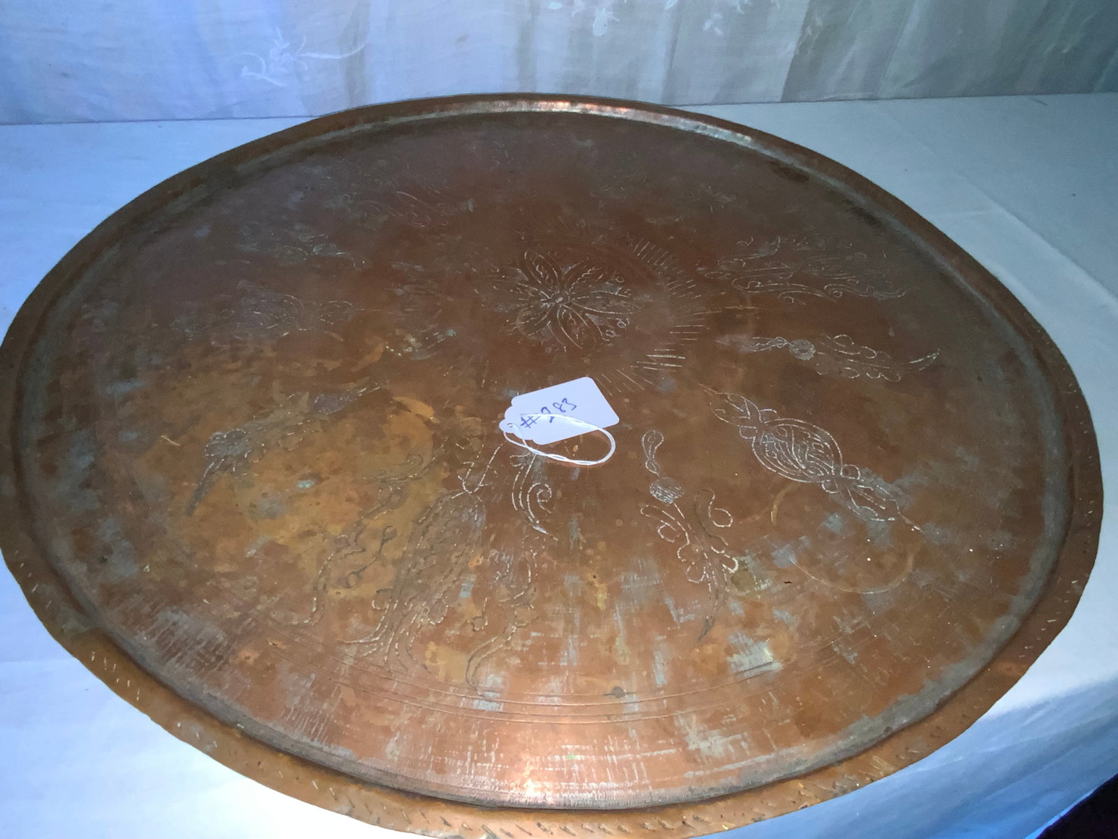 Middle Eastern Copper Tray: Round copper feasting tray, Middle Eastern, 19th century, hand hammered & hand decorated, signed. Good condition.