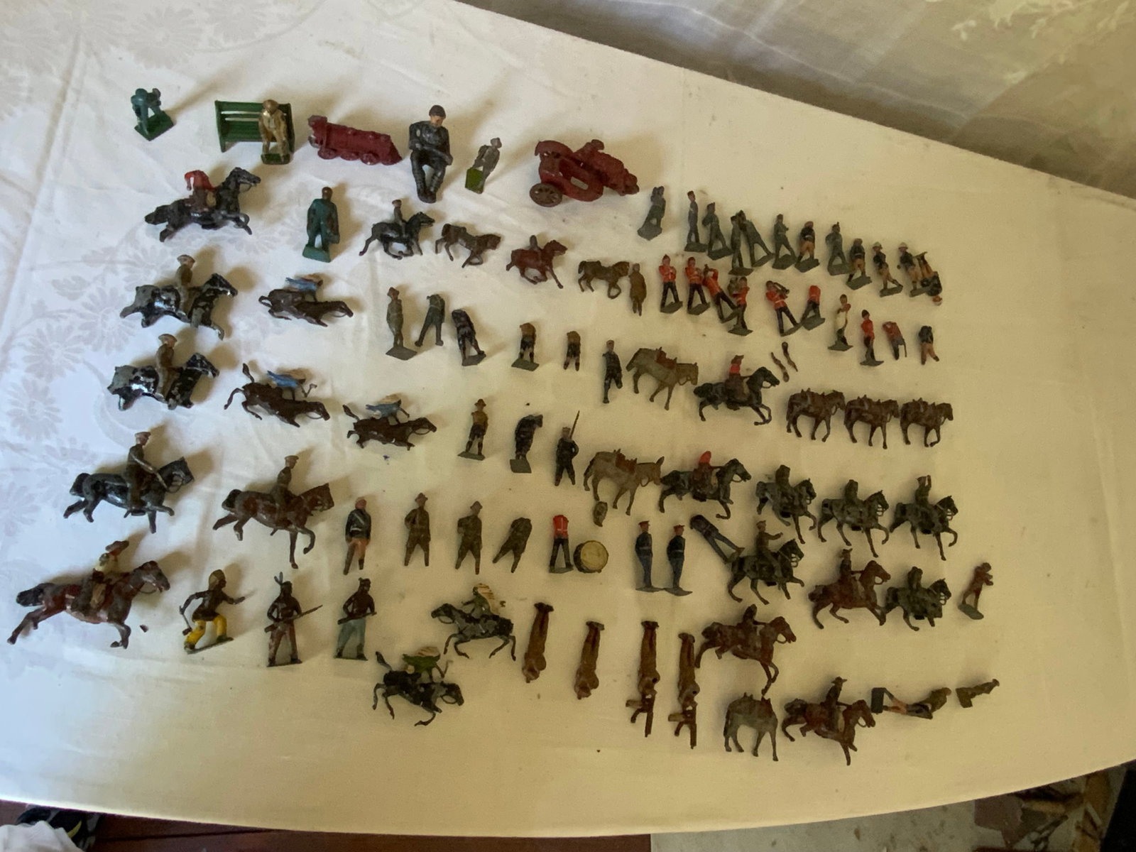 Toy Soldiers Collection: Collection of lead Britain and other soldiers, Indians & cowboys, etc., well-played-with condition. Fair condition.