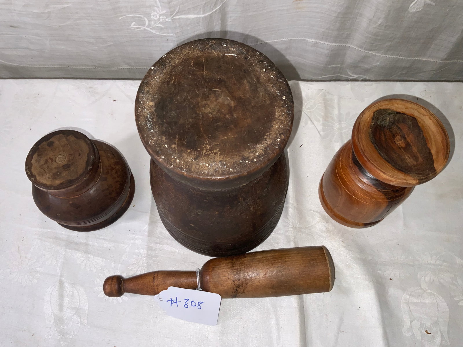 Mortars and Pestle: Mortars and pestle: 3 mortars & 1 pestle - center one 1" tall by 6 1/2" wide, right one 6" tall by 3 1/2" wide, left one 4 1/2" wide by 4" tall. Good condition.