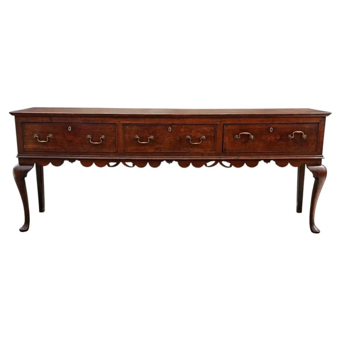 18th-Century English Georgian Oak Sideboard: 18th-century English Georgian oak sideboard dresser base, featuring a rectangular top, three drawers with original brass handles, and cabriole legs. Good colour. Impeccable
