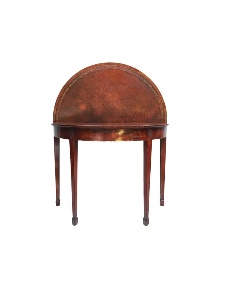 18th Century French Mahogany Card Table: French folding round card table in mahogany. Box wood stringing inlay. Embossed leather insert when opened, circa 18th century. Features original tooled playing surface, tapered legs, and a warm,