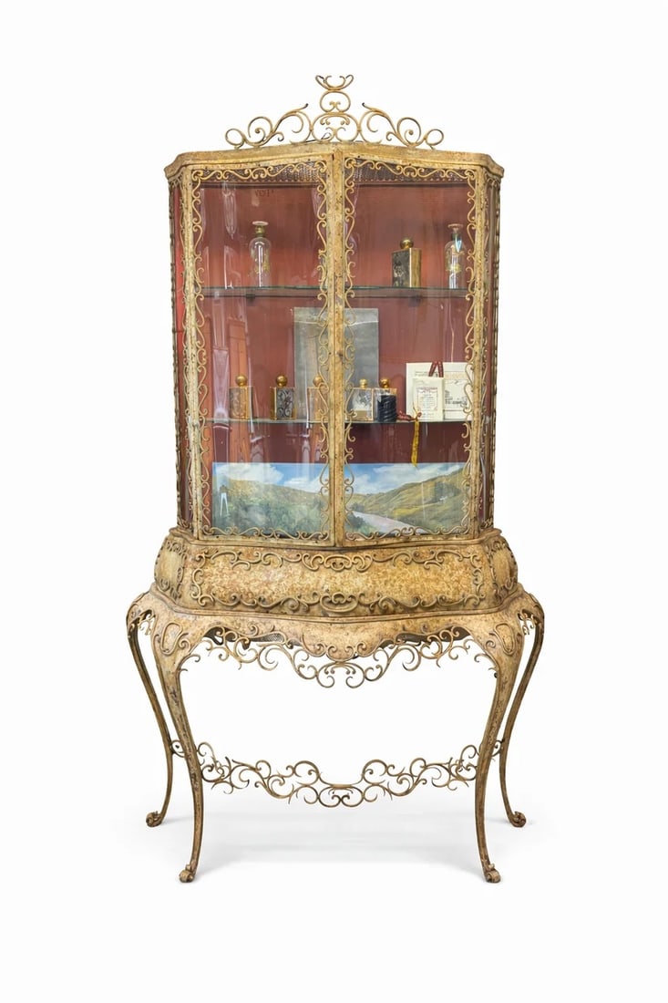 Early 20th Century Gilt Metal Italian Storage Cabinet: One of a kind piece. All hand-forged metal most beautifully suitable for an exterior logia piece and plants to interior. Piece is from Rome. All the glass is hand-blown to fit the contours of the cabi