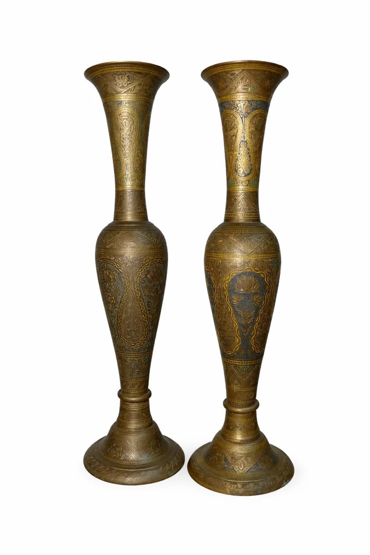 Pair of Hand Hammered Silver Lamps: These solid silver lamps were hand hammered/carved creating an extremely detailed stand. Within the carvings you can see a depiction where there is a village and its people. The scene is set to be