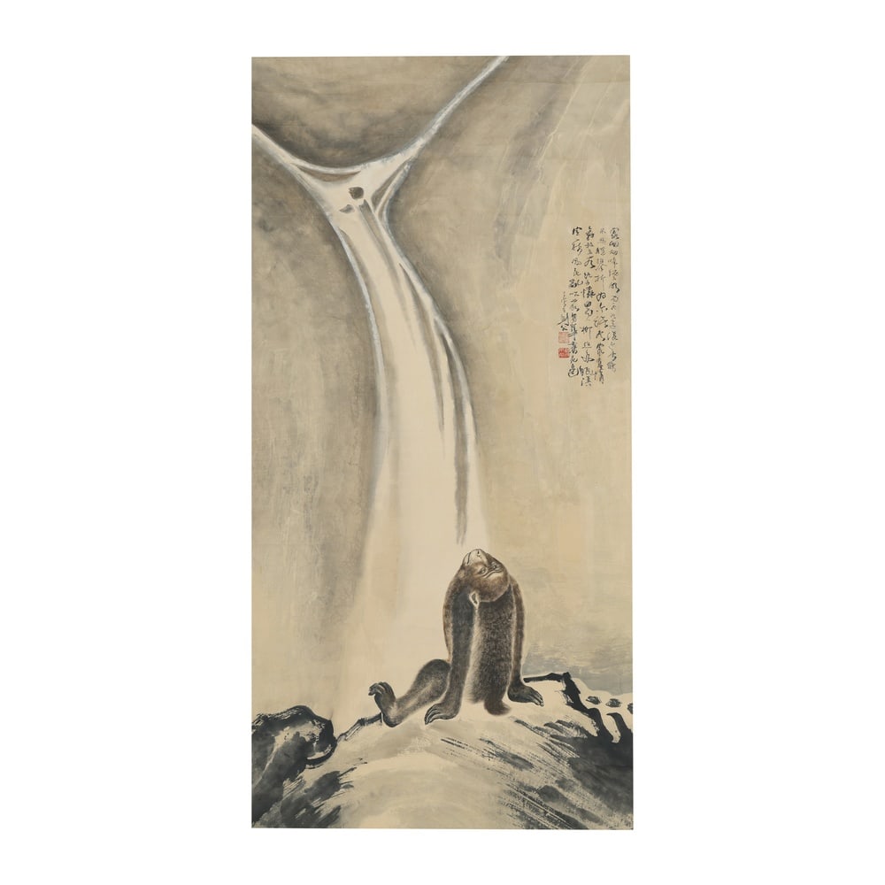 GAO JIANFU (1879-1951), INK AND COLOR ON PAPER: Image Dimensions: 53 1/2 x 26 3/4 in (136 x 68 cm) Executed in ink and color on paper, Monkey Listening to the Waterfall places an animal subject within a secluded mountainous setting. The composition