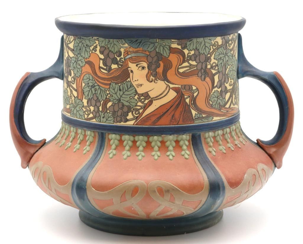 Villeroy & Boch, Mettlach Art Nouveau Jardinière: Villeroy & Boch (German, est. 1836) Mettlach No. 2874 Art Nouveau Two-Handled Jardinière Circa 1900 Art Nouveau jardinière decorated in relief with two maidens with flowing hair among gr