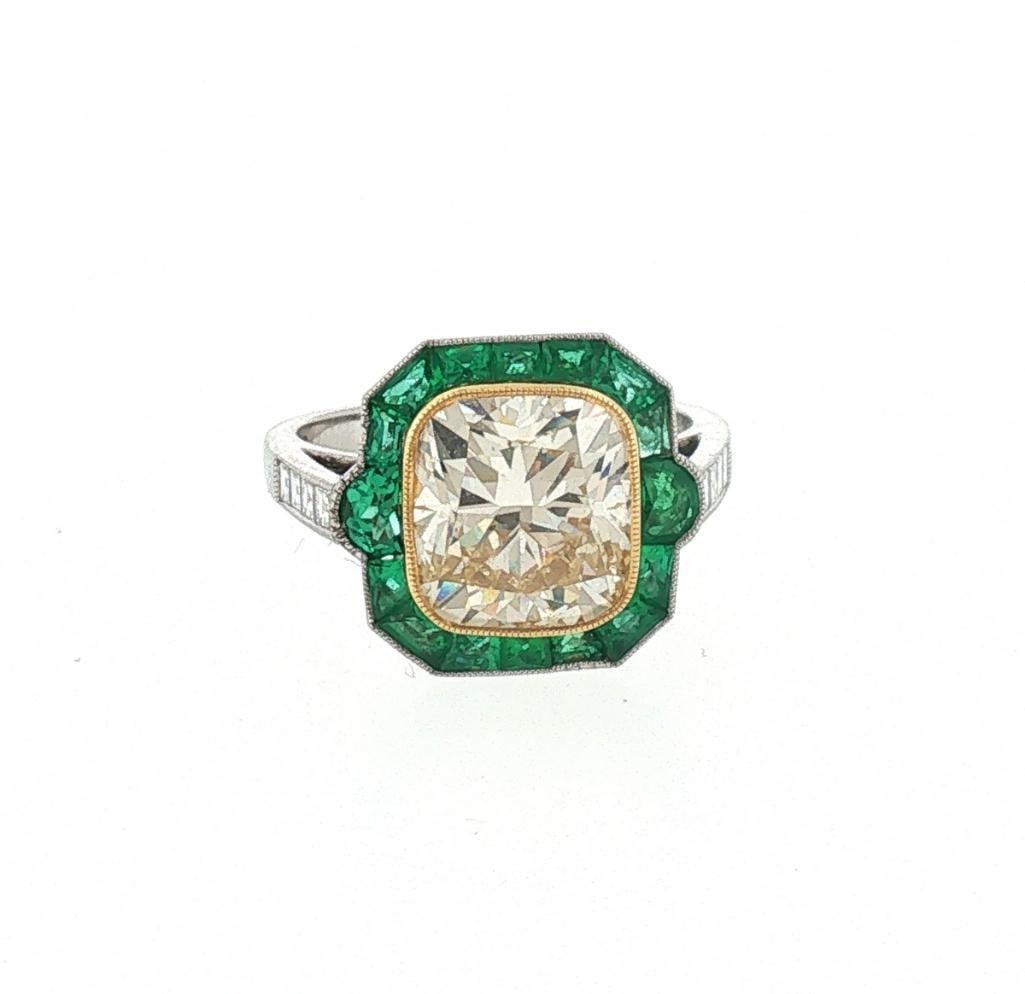 Sophia D. Platinum, 18Kt Diamond & Emerald Ladies Cocktail Ring: Sophia D. Platinum, 18K Yellow Gold, Diamond & Emerald Ladies Cocktail Ring Sophia D. platinum and 18K yellow gold ring featuring a 5.01 carat cushion-cut VVS2 diamond center stone, surrounded by 