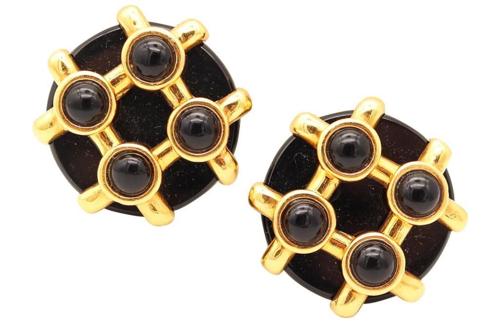 Aldo Cipullo for Cartier “Circles” 18Kt & Black Onyx Earrings: Aldo Cipullo for Cartier (Italian-American, 1936–1984) “Circles” Black Onyx Ear Clips 18K yellow gold and black onyx 1973 Pair of geometric ear clips designed by Aldo Cipullo for Car