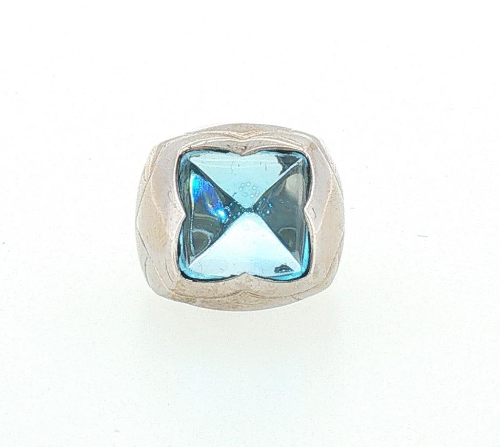 Bvlgari 18Kt & Blue Topaz Ladies Cocktail Ring: Bvlgari (Italian, est. 1884) 18K White Gold & Blue Topaz Ladies Cocktail Ring Bvlgari 18K white gold cocktail ring featuring an approximately 10 carat sugarloaf-cut blue topaz center stone in a be