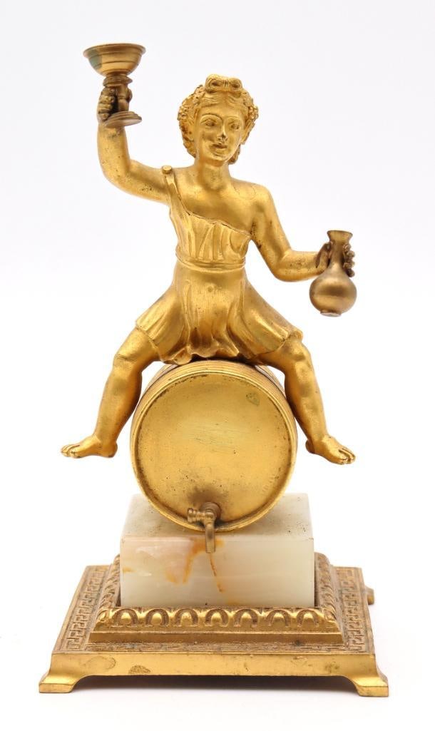 19th C. Austrian Gilt Bronze & Onyx Sculpture: Austrian, 19th Century Viennese Figural Barrel Dispenser Gilt bronze and onyx Figural gilt bronze object modeled as a classical female figure seated upon a barrel, holding a raised drinking vessel and