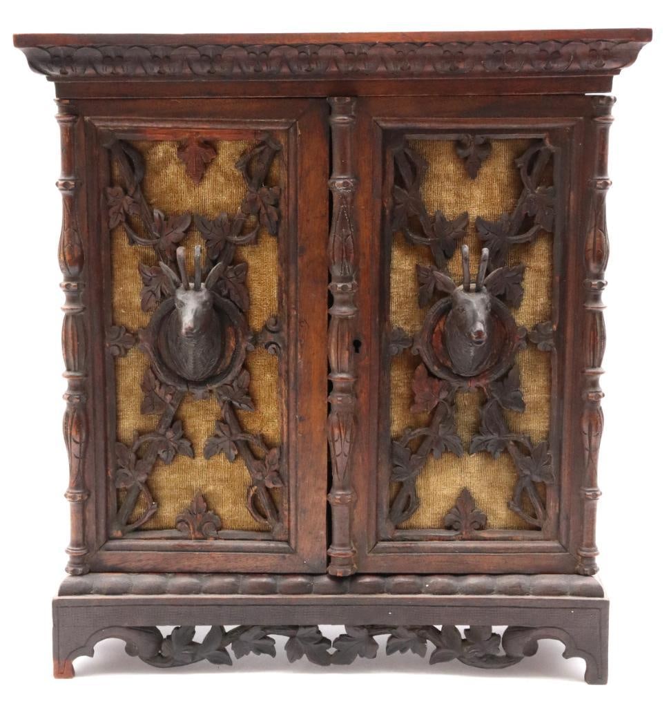 Antique Black Forest Tantalus Set: Antique Black Forest Tantalus Set Carved wood with crystal stemware Swiss/German, 19th Century Finely carved Black Forest tantalus cabinet featuring a pair of hinged doors with applied game trophies d