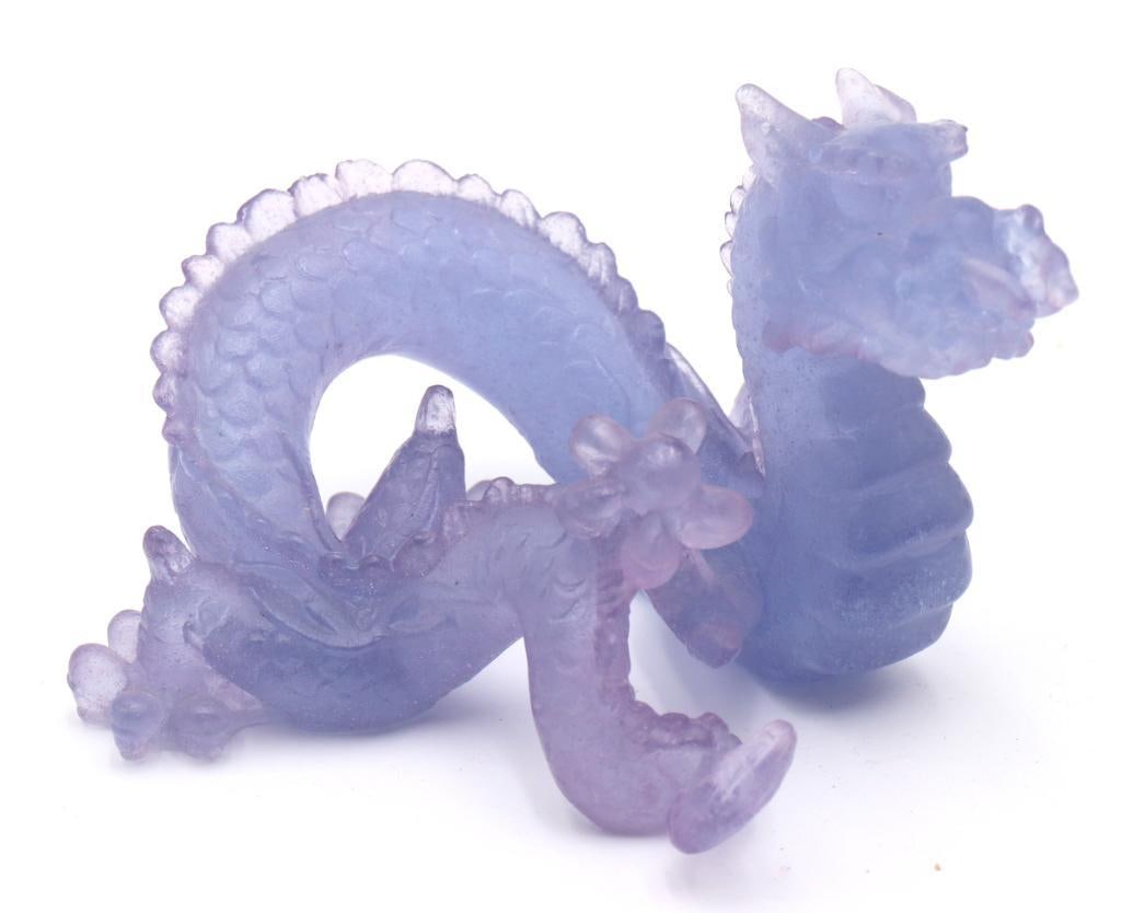 Daum “Dragon” Amethyst Crystal Sculpture: Daum France (French, est. 1878) “Dragon” Amethyst pte de verre crystal sculpture Sculptural figure depicting a coiled dragon rendered in translucent amethyst pte de verre crystal, with fin