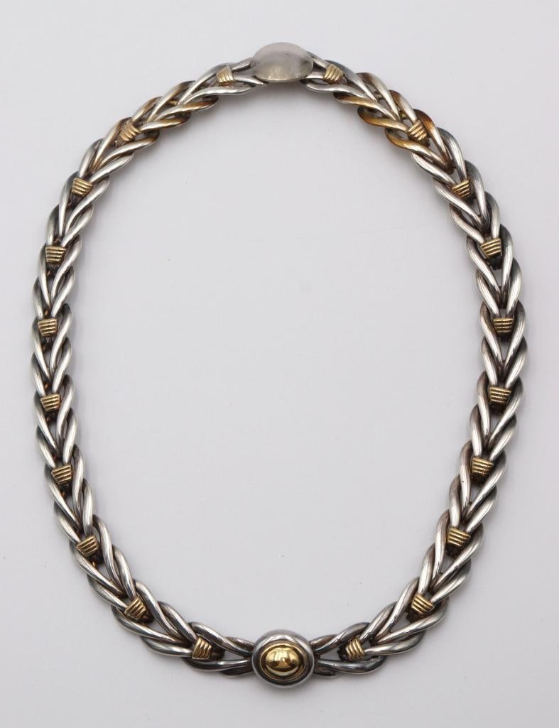 Christofle 18Kt & Sterling Silver Necklace: Christofle (French, est. 1830) 18K Yellow Gold & Sterling Silver Ladies Necklace Christofle sterling silver necklace featuring an interwoven link design with 18K yellow gold accents throughout and