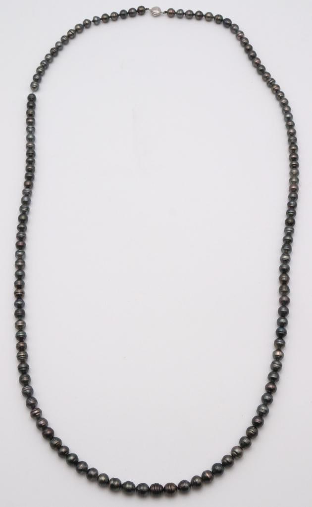 Gauguin’s Pearl 48" Tahitian Cultured Pearl Necklace: Gauguin’s Pearl Tahitian cultured pearl necklace Long strand composed of approximately 126 cultured Tahitian pearls of baroque form, displaying dark gray to black tones with natural iridescent o