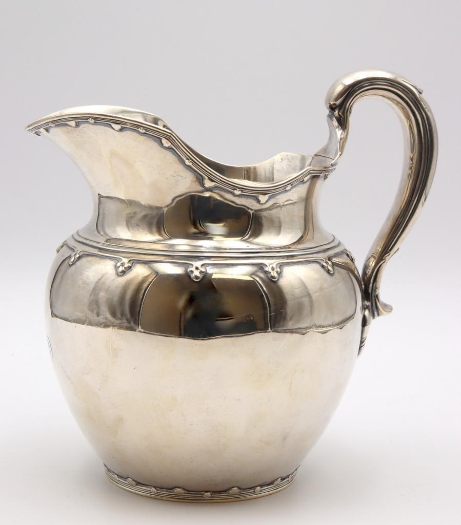 Early 20th C. Tiffany & Co. Sterling Silver Pitcher: Tiffany & Co. Sterling Silver Pitcher Early 20th century Tiffany & Co. sterling silver pitcher with applied decorative border and scrolling handle, monogrammed “M.” Marked Tiffany 