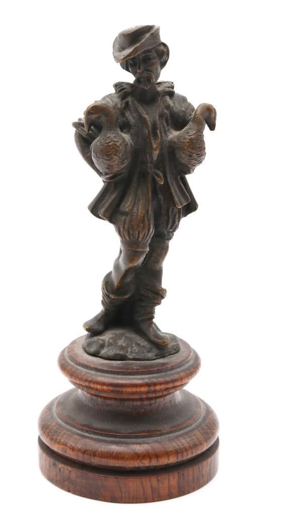 French School (Late 19th C.) Miniature Bronze Sculpture: French School (Late 19th Century) Man with Two Ducks Patinated bronze sculpture Miniature bronze sculpture depicting a standing man in traditional dress carrying two ducks, mounted on a turned wooden 