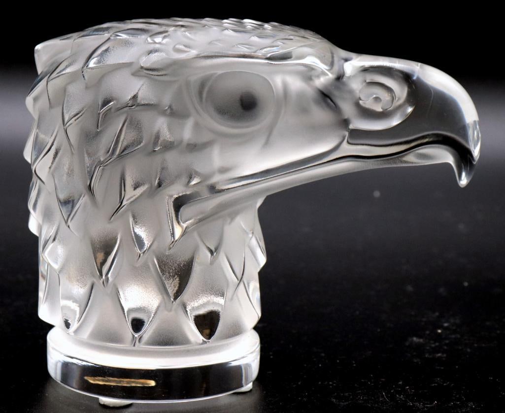 Lalique “Tête d’Aigle” Crystal Sculpture: Lalique (French, est. 1888) “Tête d’Aigle” Crystal sculpture Sculptural crystal eagle head rendered with a prominent hooked beak and detailed feathering, combining frosted and c