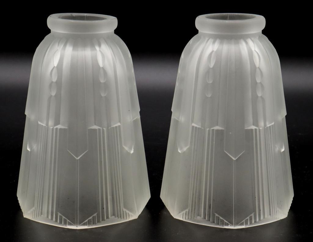 Pair of Art Deco Glass Shades: Pair of Art Deco Glass Shades Frosted glass Pair of Art Deco frosted glass light shades featuring a tapered geometric form with molded vertical fluting and stylized decorative details. No visible make