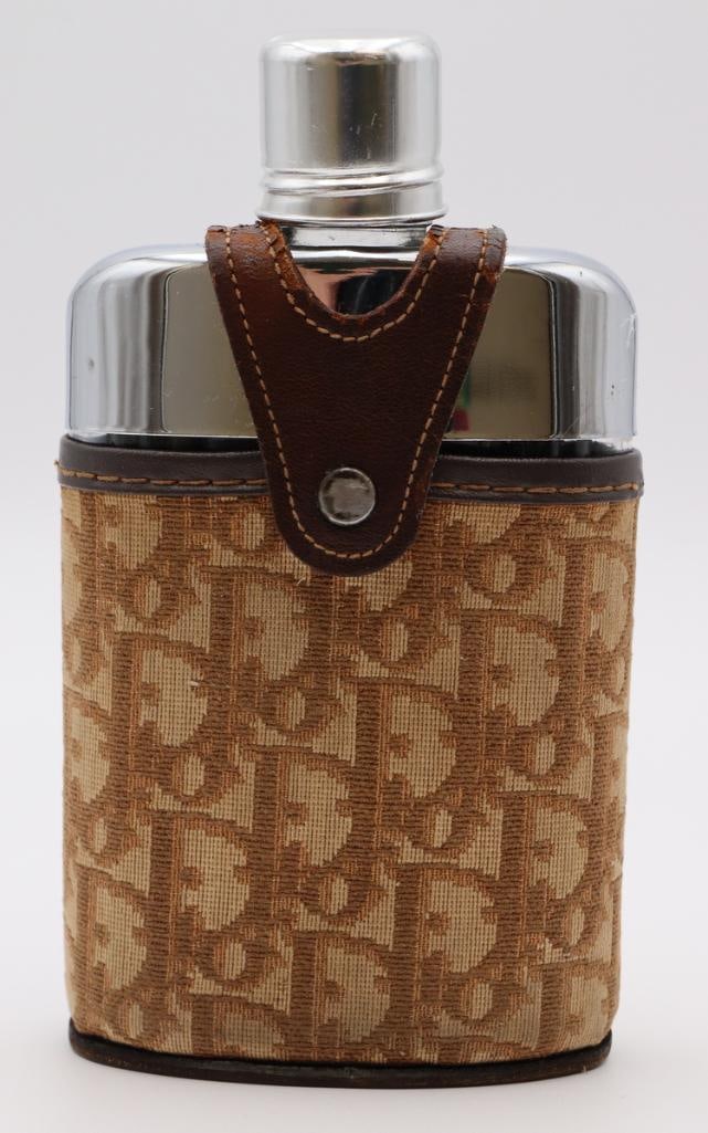 Christian Dior Monogram Glove Steer Leather Flask: Christian Dior (French, est. 1946) Monogram Glove Steer Leather Flask Metal, monogram canvas and leather Vintage Christian Dior flask featuring a polished metal body housed in a brown Dior monogram ca
