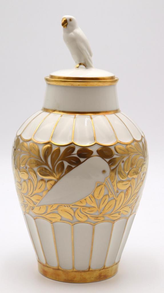 Fritz Klee for Hutschenreuther Lidded Parrot Vase: Fritz Klee for Hutschenreuther Lidded parrot vase Porcelain lidded vase with off-white ground, gilt parrot and foliate decoration, and a sculptural parrot finial. Underside marked “Entwurf: Prof