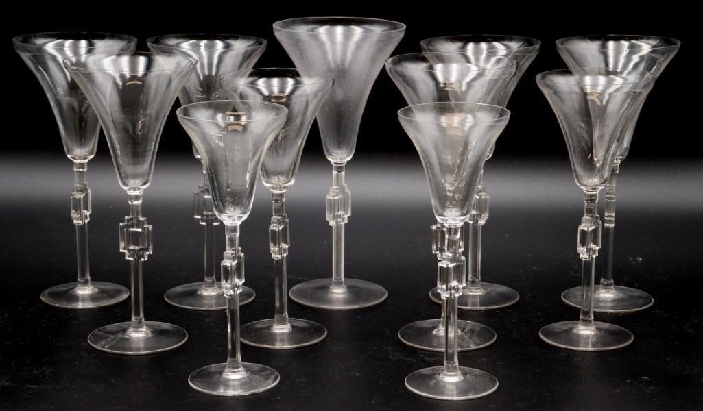 René Lalique (French, 1860-1945) “Hagueneau” Glasses: René Lalique (French, 1860–1945) “Hagueneau” Glasses Model No. 5023 Circa 1924 Set of eleven glass stems in the “Hagueneau” pattern by René Lalique, Model No. 5