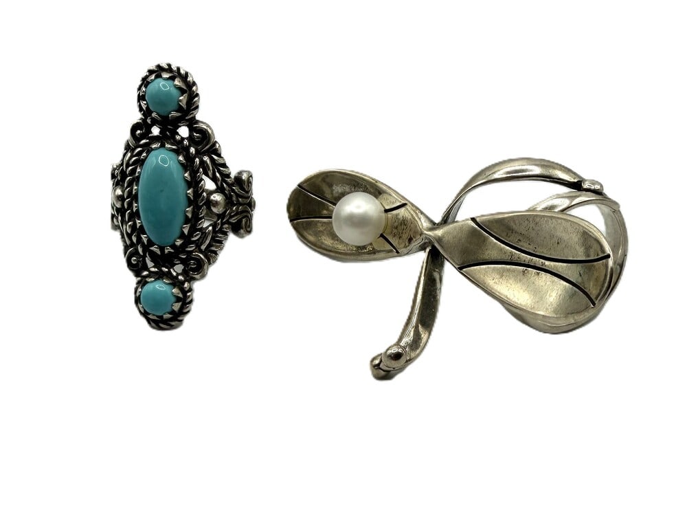 Pair of Carolyn Pollack rings: Vintage Carolyn Pollack rings, one with a pearl and dagronfly design, and the other with scroll work and three turquoise stones, both marked