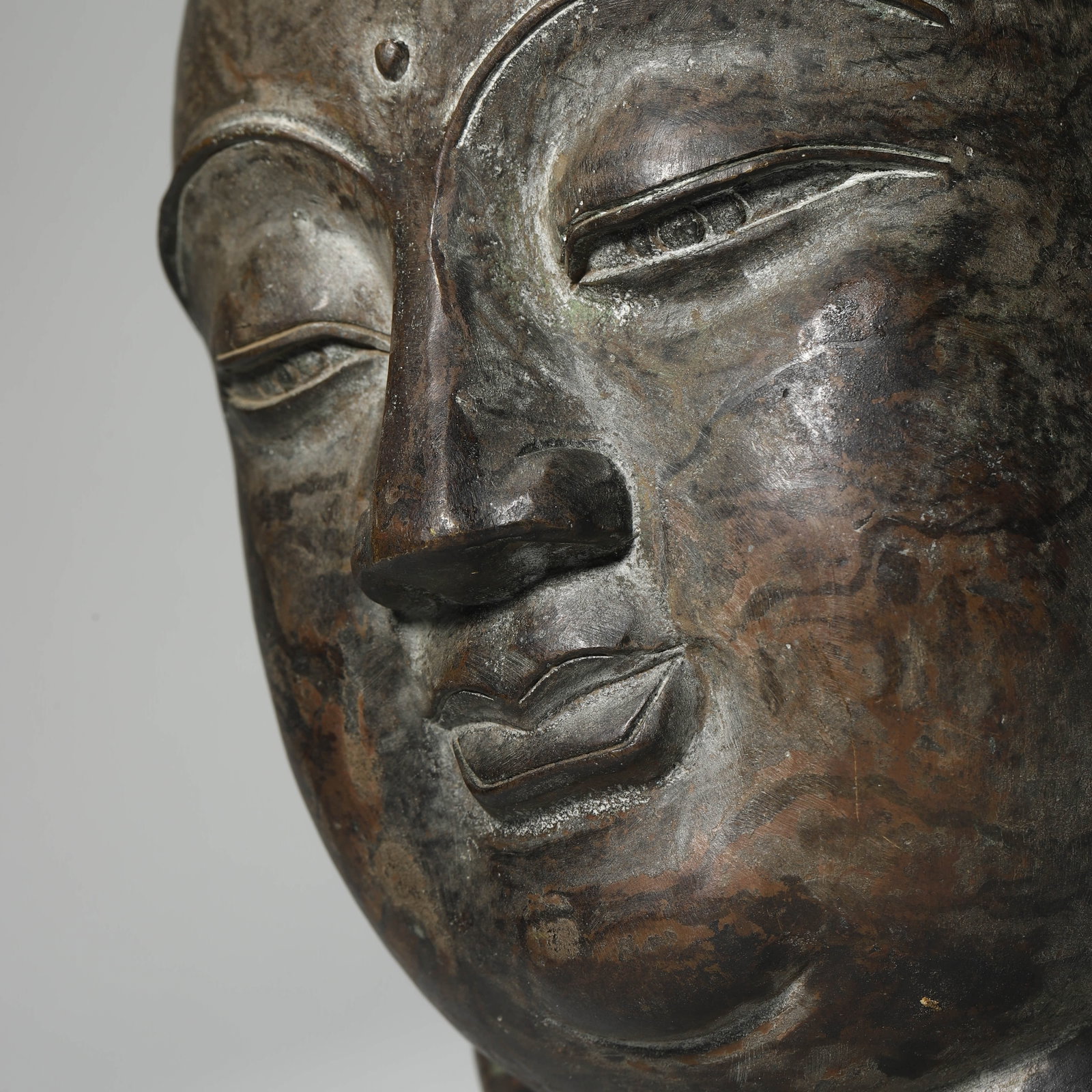 A BRONZE BUDDHA HEAD - 3