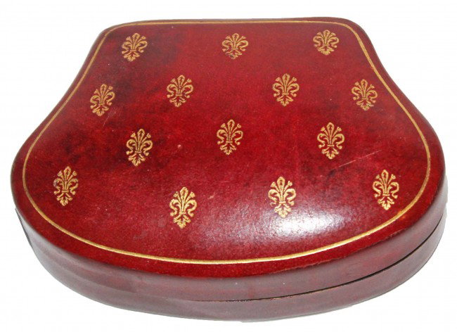 Embossed Italian Leather Box: This is a red stained leather box with gold embossing and black felt interior. Made in Florence, Italy. DIMENSIONS: Length: 3.5 inches Width: 2.5 inches Height: 1 inch