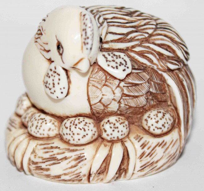 Ivory Japanese Netsuke: Ivory Japanese netsuke of a hen sitting on eggs on a nest. The netsuke is signed on the bottom. DIMENSIONS: Length: 1.75 inches Width: 1.5 inches Height: 1.5 inches