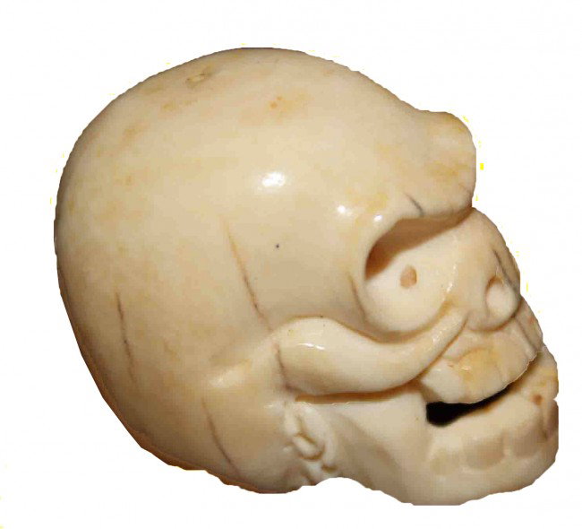 Japanese Ivory Netsuke of a Skull: Ivory Japanese netsuke of a skull. Signed on the bottom. DIMENSIONS: Length: 1 inch Width: 1.5 inches Height: 1 inch