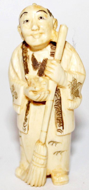 Japanese Ivory Netsuke of Man with Bird and Broom: Very nice ivory Japanese netsuke of a man with a bird in hand and a broom. It has good detail but only black in the carvings. DIMENSIONS: Length: 1 inch Width: .75 inch Height: 2 inches