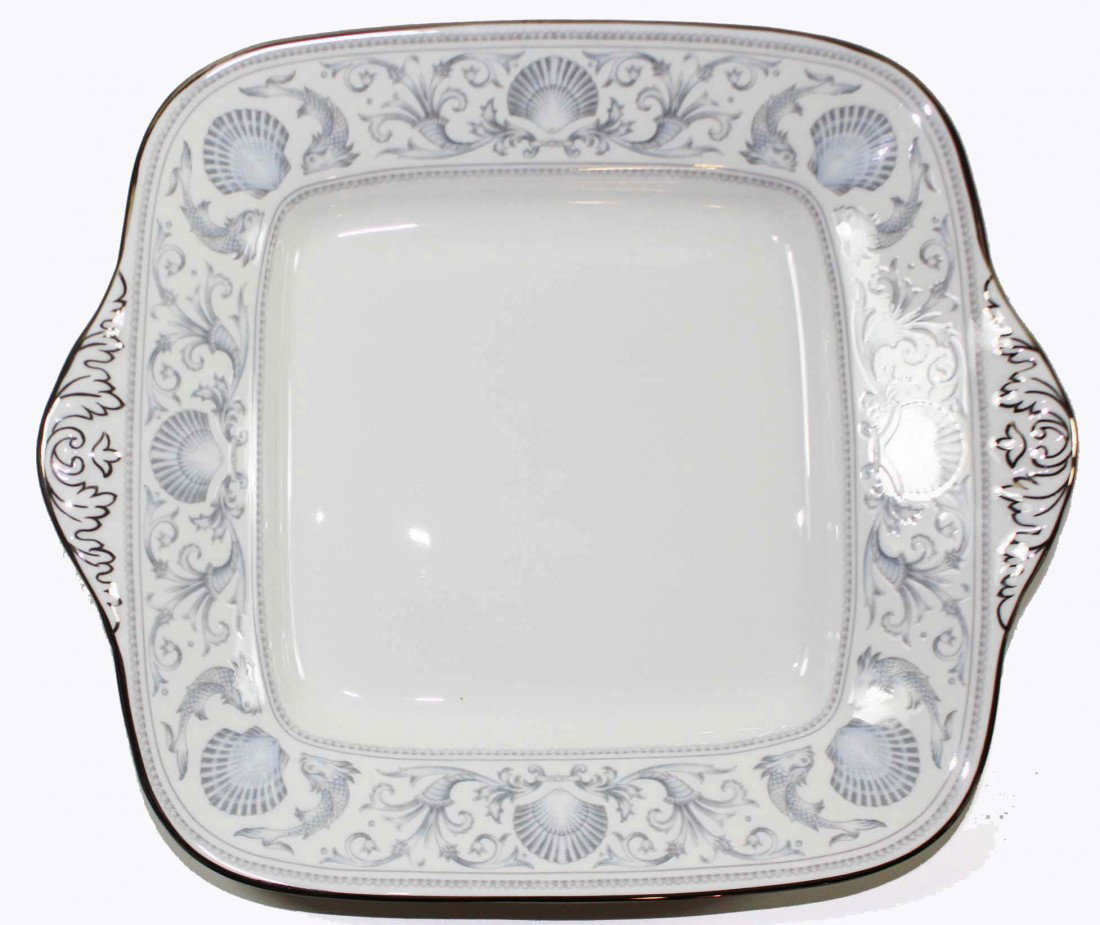 Wedgwood Dolphins Bread Plate: Beautiful Wedgwood Dophins bread plate. It has a grey and pale blue border of scallops dolphins and scroll work. The rims are silver and the handles have silver scroll work. Ther are no visible scratc