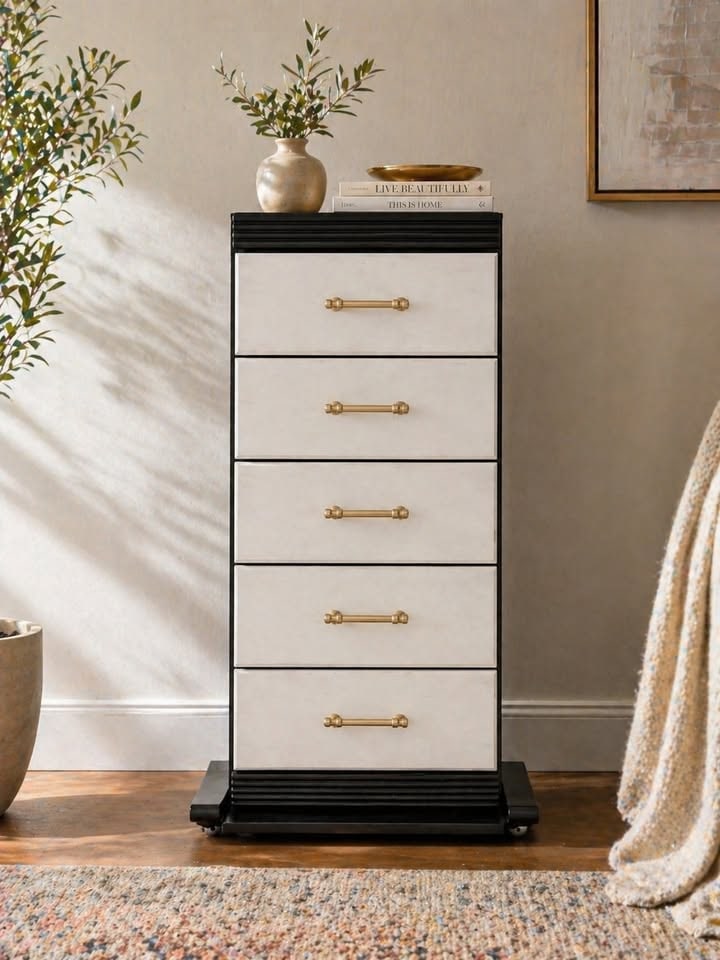 Contemporary Black and Cream Five-Drawer Chest of Drawers with Brass Pulls: A modern five-drawer chest of drawers featuring a contrasting design. The frame and top are finished in black with fluted detailing on the top and base, while the five drawer fronts are a light cream 