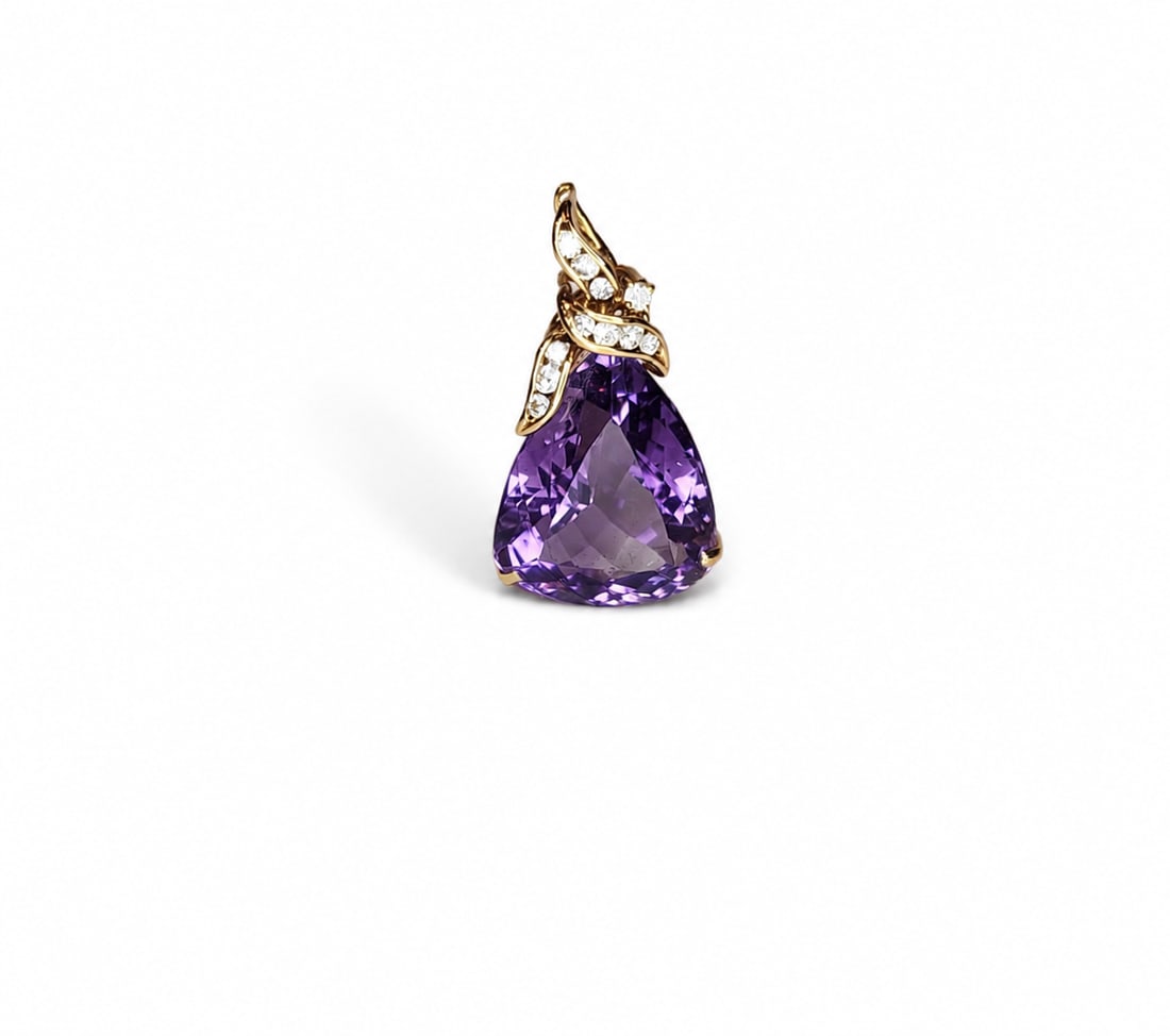 Yellow gold Amethyst and diamond pendant: A 14kt yellow gold Amethyst and diamonds Pendant. Amethyst . 10 ct. triangle and 0.35 ct diamonds. 1x0.55 inches 5.3 grams