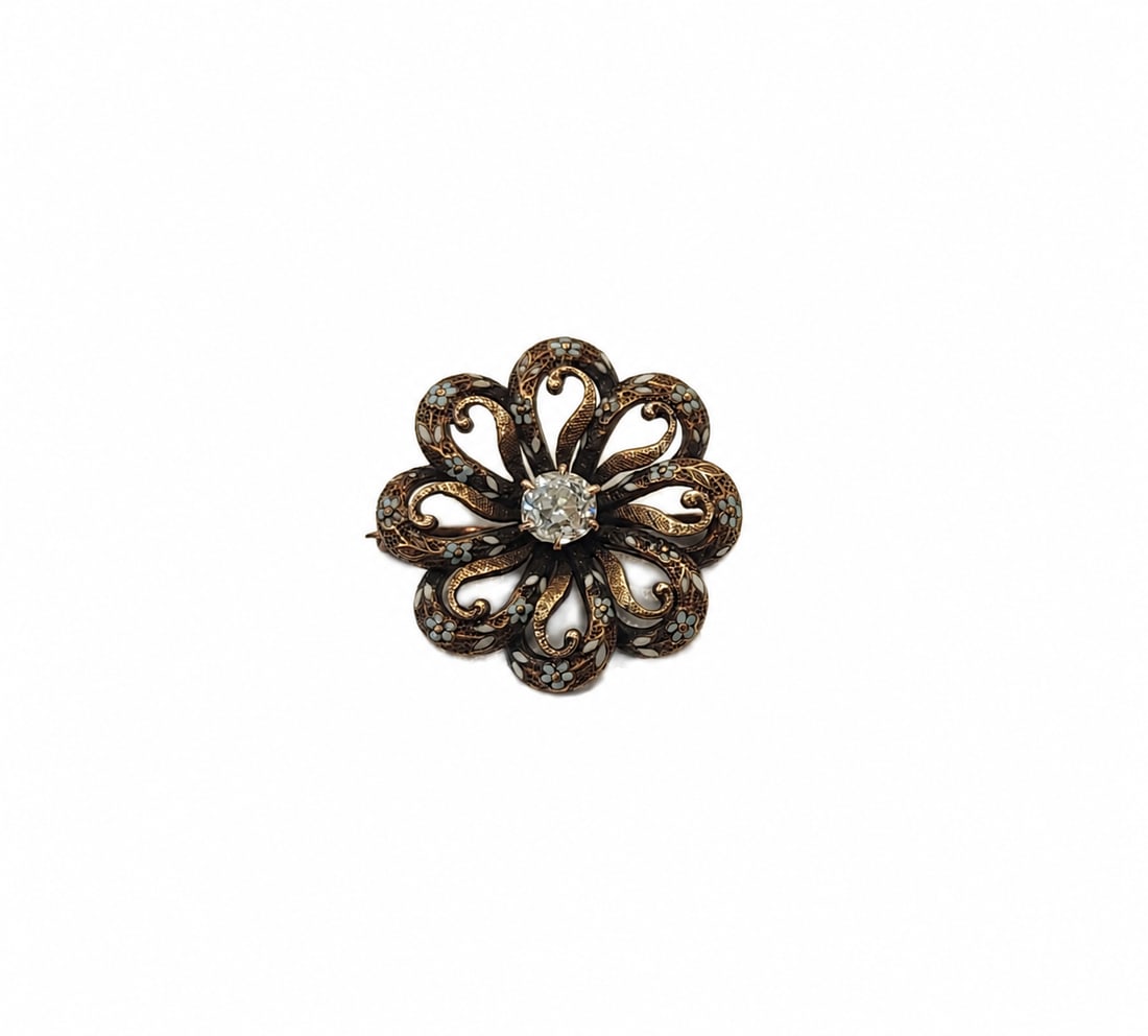Antique floral white gold diamond and enamel brooch: Antique 14kt white gold floral brooch with enamel. .40 European cut diamond I-J color VS-SI quality. 0.80x0.80. 2.85 grams