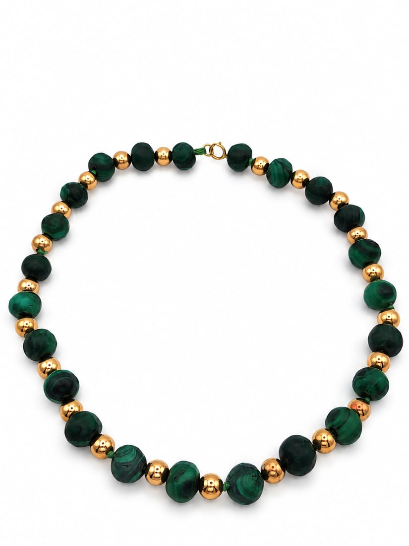 Yellow gold Malachite necklace: A malachite necklace. Strung with malachite and 14kt gold balls and clasp. 11-12.5 mm range. Gold balls are 8 mm. 17 inches long. 78.5 Grams. The malachite are not perfectly round.